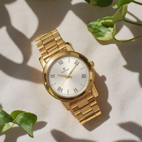Titan Quartz Analog with Day and Date Champagne Dial Stainless Steel Strap Watch for Men (Model 1644YM01)