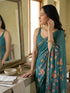 Vasthrlay Turquoise Floral Linen Saree With Solid Black Unstitched Blouse