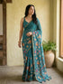 Vasthrlay Turquoise Floral Linen Saree With Solid Black Unstitched Blouse