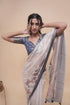 Vasthrlay Cream Abstract Print Polyester Saree With Antique Zari Border And Unstitched Blouse Piece