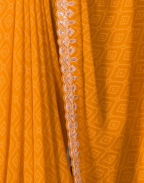 Vasthrlay Georgette Embroidery Turmeric Yellow Saree With Red Unstitched Blouse Piece