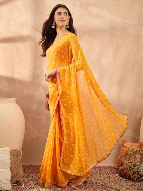 Vasthrlay Vasthrlaywomensyellowgeorgettebandhaniprintembroideredlaceworksareewithunstitchedblousepiece Sareeforwoman Designersareeforwomen Tr Ethnic Wear