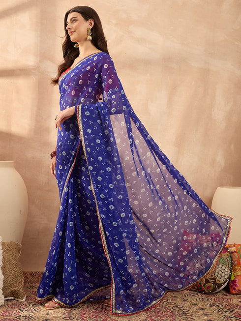 Vasthrlay Vasthrlaywomensbluegeorgettebandhaniprintembroideredlaceworksareewithunstitchedblousepiece Sareeforwoman Designersareeforwomen Tr Ethnic Wear
