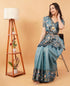 Vasthrlay Teal Blue Textured Polyester Saree With Kalamkari Floral Border And Ruched Unstitched Blouse Piece