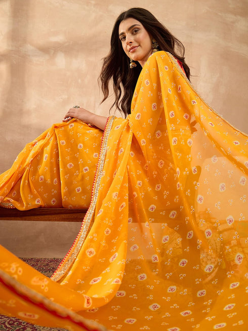 Vasthrlay Vasthrlaywomensyellowgeorgettebandhaniprintembroideredlaceworksareewithunstitchedblousepiece Sareeforwoman Designersareeforwomen Tr Ethnic Wear