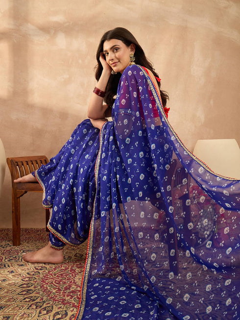 Vasthrlay Vasthrlaywomensbluegeorgettebandhaniprintembroideredlaceworksareewithunstitchedblousepiece Sareeforwoman Designersareeforwomen Tr Ethnic Wear