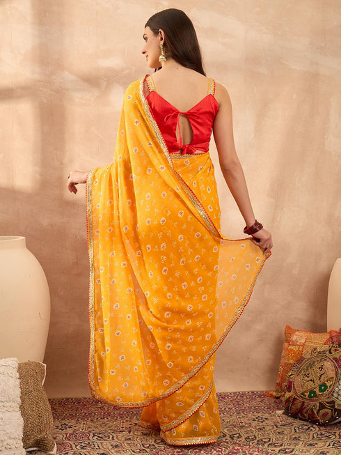 Vasthrlay Vasthrlaywomensyellowgeorgettebandhaniprintembroideredlaceworksareewithunstitchedblousepiece Sareeforwoman Designersareeforwomen Tr Ethnic Wear