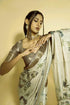 Vasthrlay Off White Abstract Print Polyester Saree With Antique Zari Border And Unstitched Blouse Piece