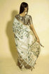 Vasthrlay Off White Abstract Print Polyester Saree With Antique Zari Border And Unstitched Blouse Piece