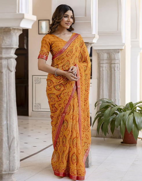 Vasthrlay Georgette Bandhani Yellow And Red Saree With Unstitched Blouse Piece