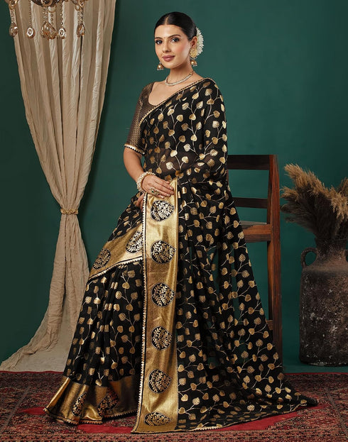 Vasthrlay Georgette Printed Black And Gold Saree With Unstitched Blouse Piece