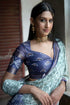 Vasthrlay Off White Green Textured Polyester Saree With Kalamkari Floral Panel| Zari Border And Unstitched Blouse Piece