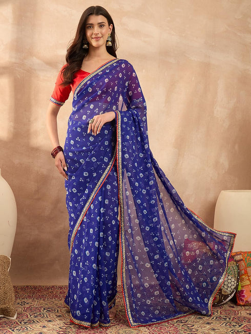 Vasthrlay Vasthrlaywomensbluegeorgettebandhaniprintembroideredlaceworksareewithunstitchedblousepiece Sareeforwoman Designersareeforwomen Tr Ethnic Wear