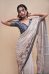 Vasthrlay Cream Abstract Print Polyester Saree With Antique Zari Border And Unstitched Blouse Piece