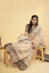 Vasthrlay Cream Terracotta Abstract Print Polyester Saree With Zari Border And Unstitched Blouse Piece
