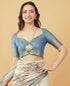Vasthrlay Cream Dusty Blue Textured Polyester Saree With Kalamkari Floral Border And Ruched Unstitched Blouse Piece