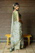 Vasthrlay Sage Green Abstract Print Polyester Saree With Zari Border And Unstitched Blouse Piece