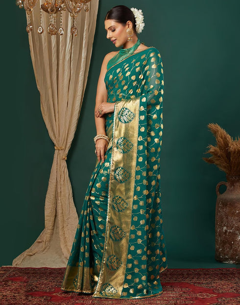 Vasthrlay Georgette Printed Teal Green Saree With Unstitched Blouse Piece