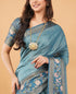 Vasthrlay Teal Blue Textured Polyester Saree With Kalamkari Floral Border And Ruched Unstitched Blouse Piece