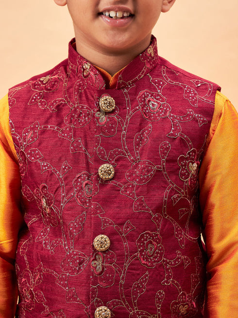 Vastramay Boy's Maroon Nehru Jacket With Orange Kurta And Pyjama Set