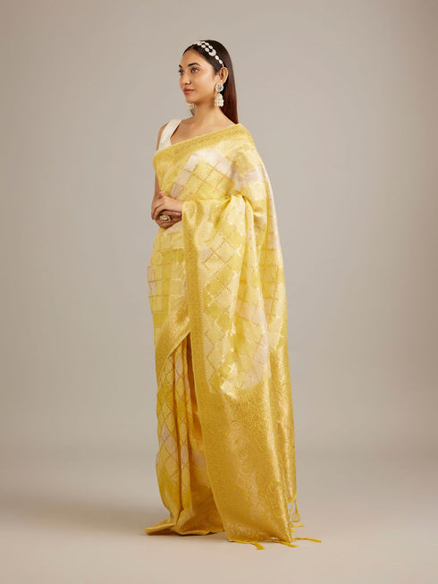 Mohey Canary Yellow Floral Grid Patterned Saree with Intricate Borders And Tassel Trims