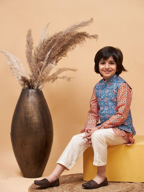 Vastramay Boy's Orange Printed Kurta And Cream Pyjama Set With Blue Nehru Jacket