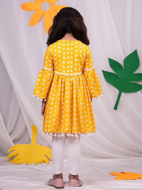 Vastramay Girl's Yellow Printed Ruffle Kurta With Leggings Set
