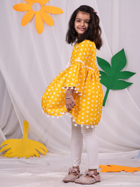 Vastramay Girl's Yellow Printed Ruffle Kurta With Leggings Set