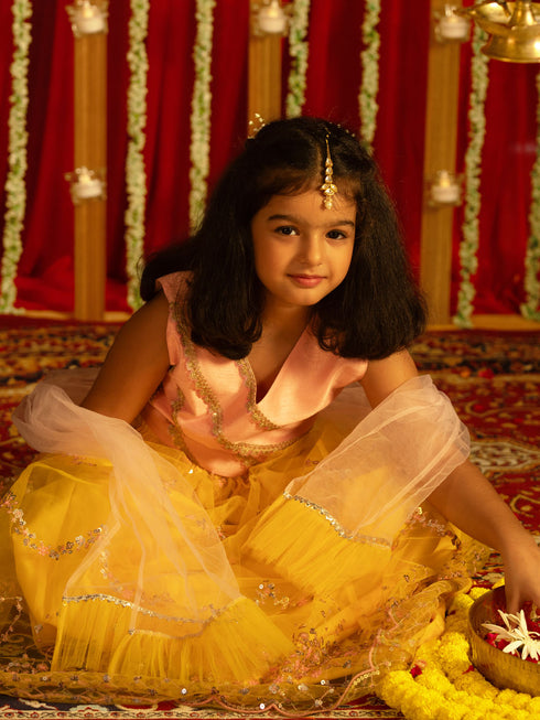 Vastramay Girls' Pink Crop Top And Yellow Net Lehenga With Ruffled Dupatta Set