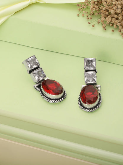 Earrings shown from the side to highlight drop design