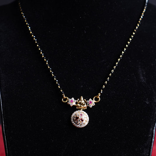 Pure Gold Black Beads With Pink And White Stoned Laxmi Locket Mangalsutra 9.71g