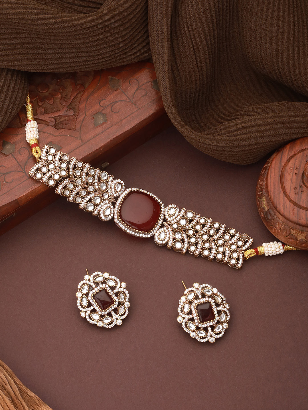 Full view of the necklace and earring set worn