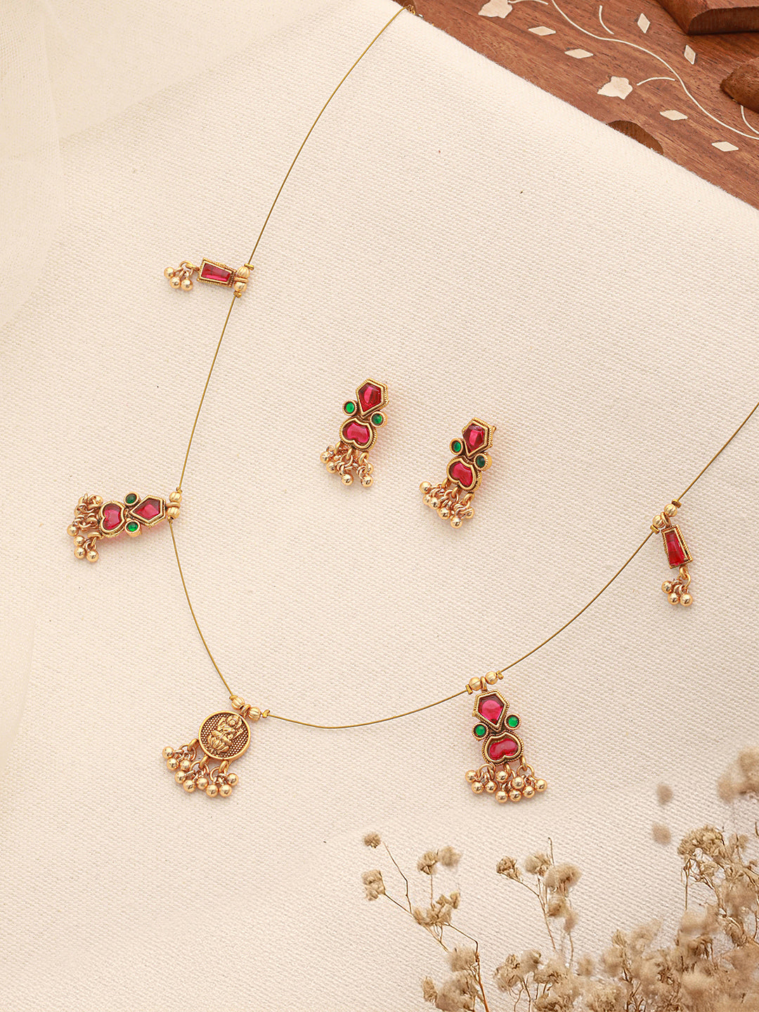 Matching gold plated earrings with enamel detail