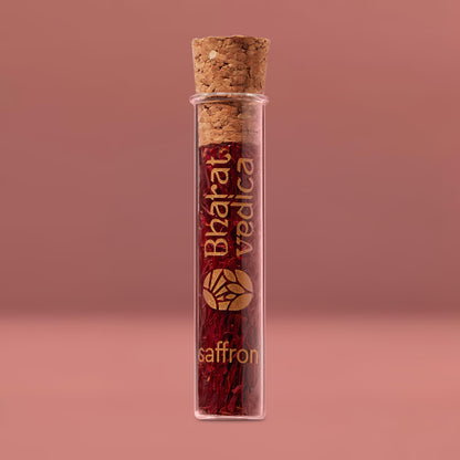 Bharat Vedica Premium Kashmiri Saffron threads in a glass jar, showcasing their vibrant crimson color.