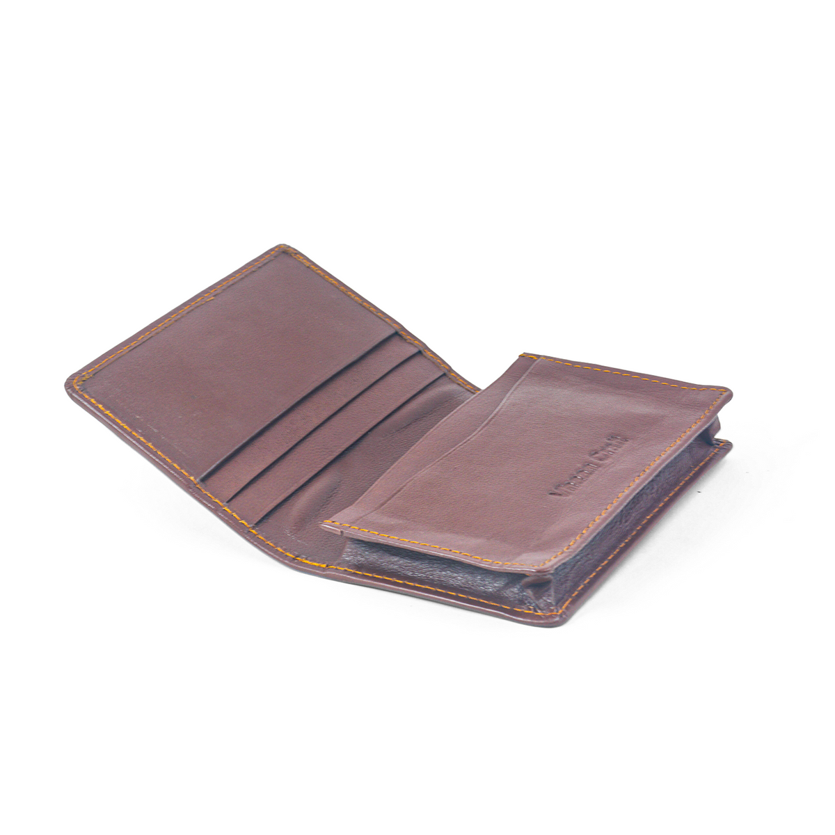 Vhaanfootwear Premium Leather Card Holder - held in hand, being placed into a jacket pocket.