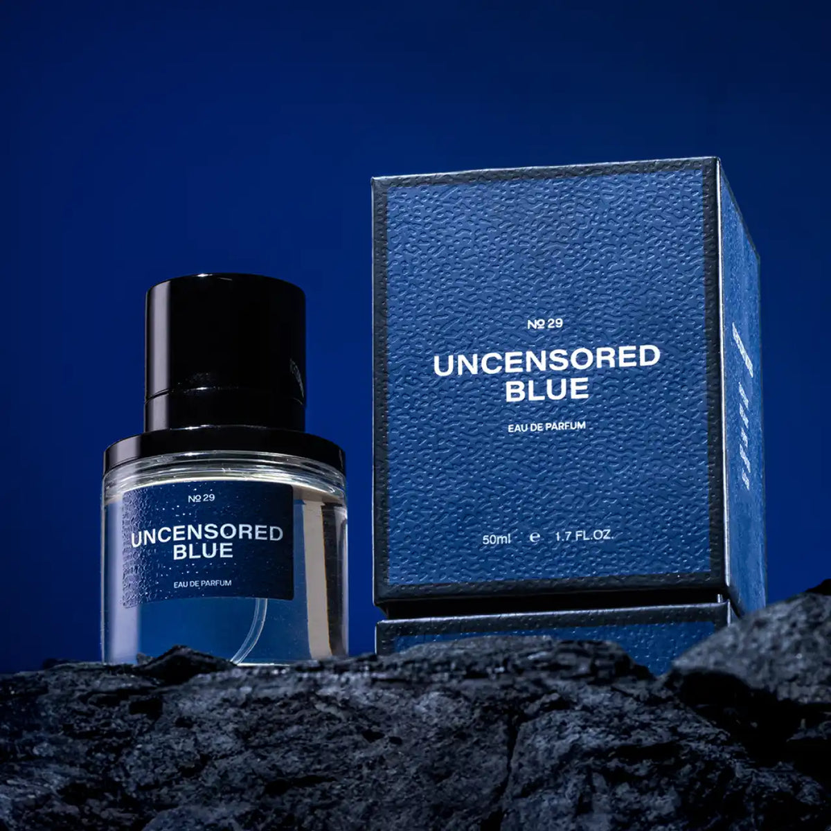 The full Fraganote Uncensored Blue perfume bottle standing upright, emphasizing its luxurious presence.