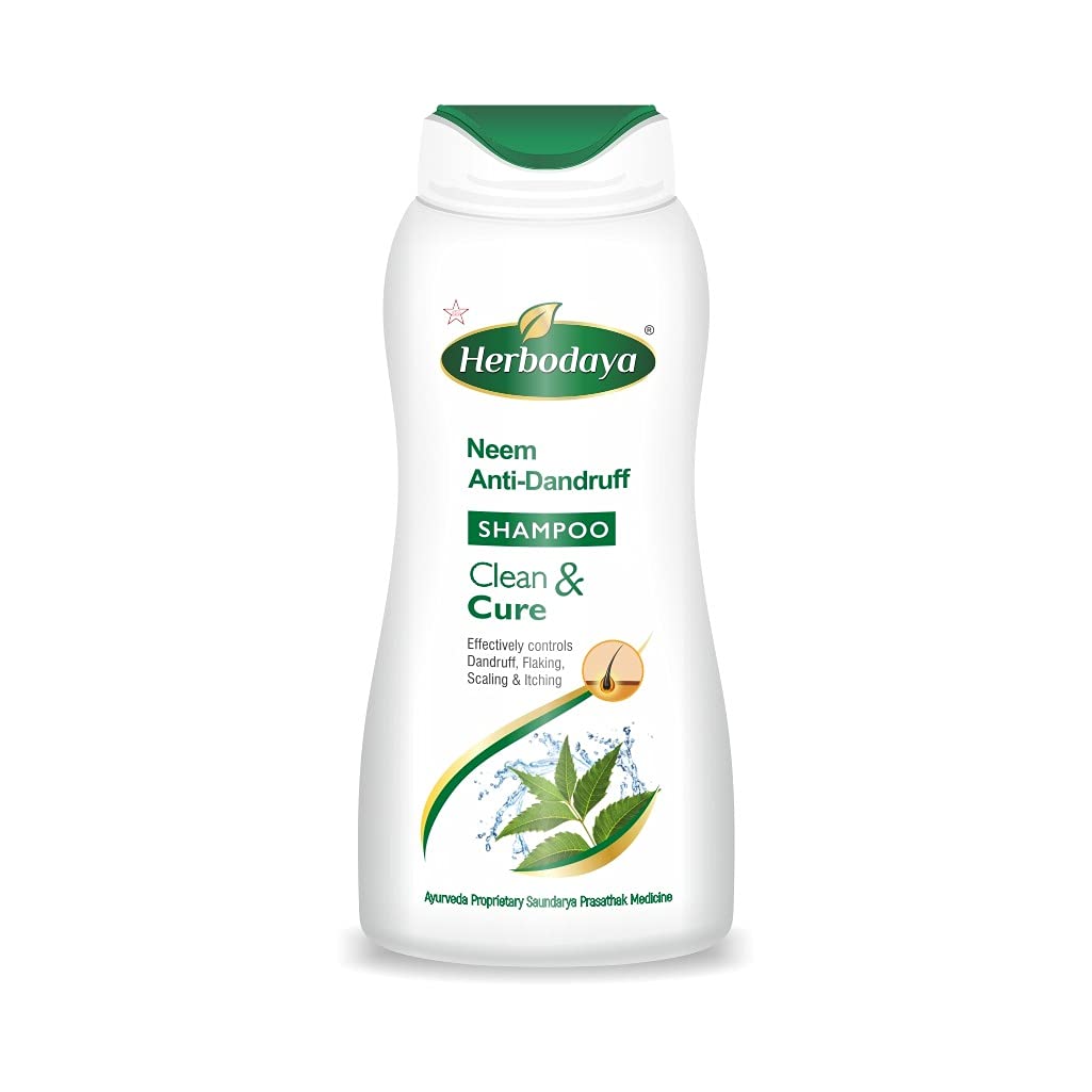 A sleek bottle of Herbodaya Neem Antidandruff shampoo, featuring green and white branding, against a clean background.