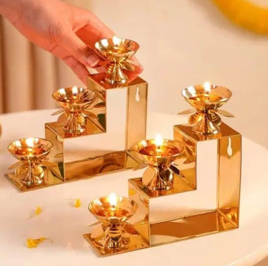 Brass 3 Step Lotus Petal Diya Set of 2 - lit lamps view