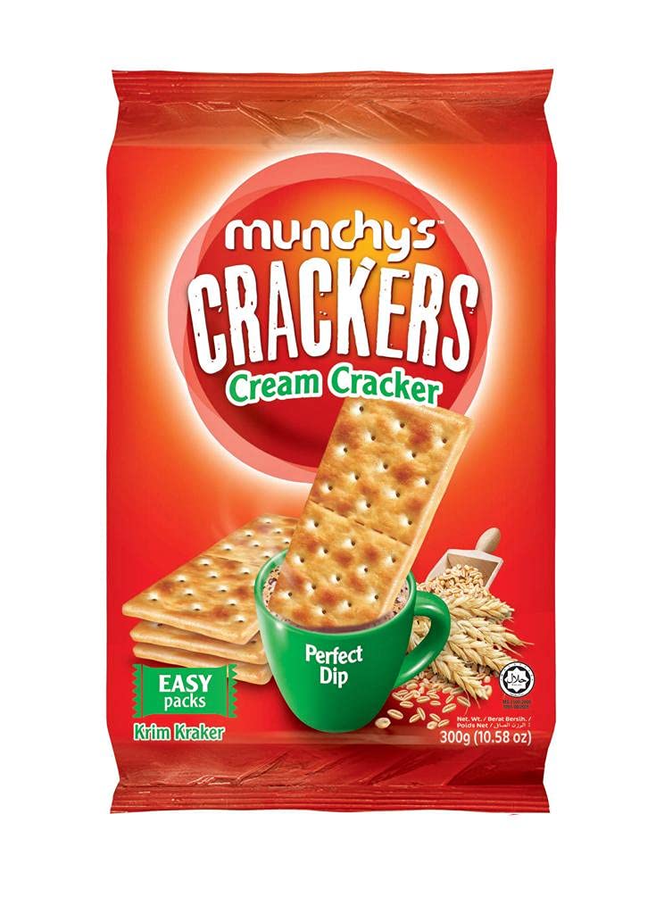 An open pack of Munchy's Wheat Crackers, with a hand reaching for a cracker, ready for snacking.