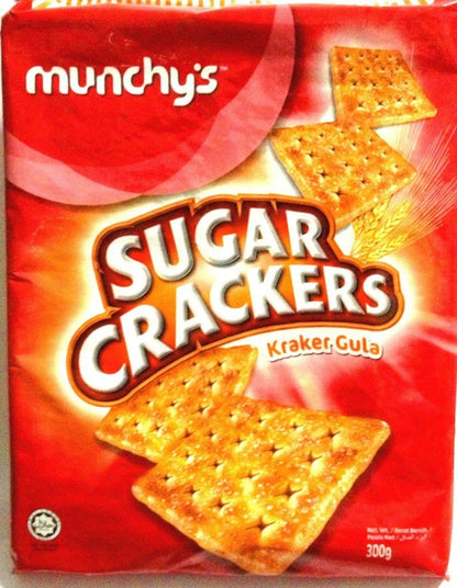 Munchy's wholesome wheat crackers arranged on a board with various toppings like cheese and fruit.