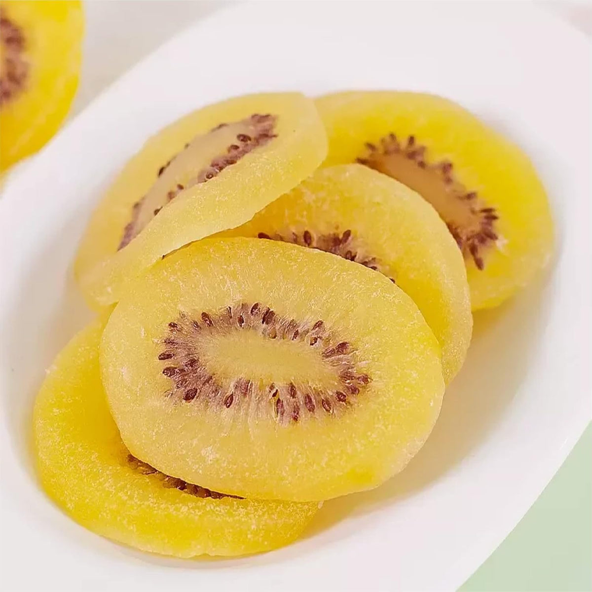 Dried yellow kiwi slices on a plate