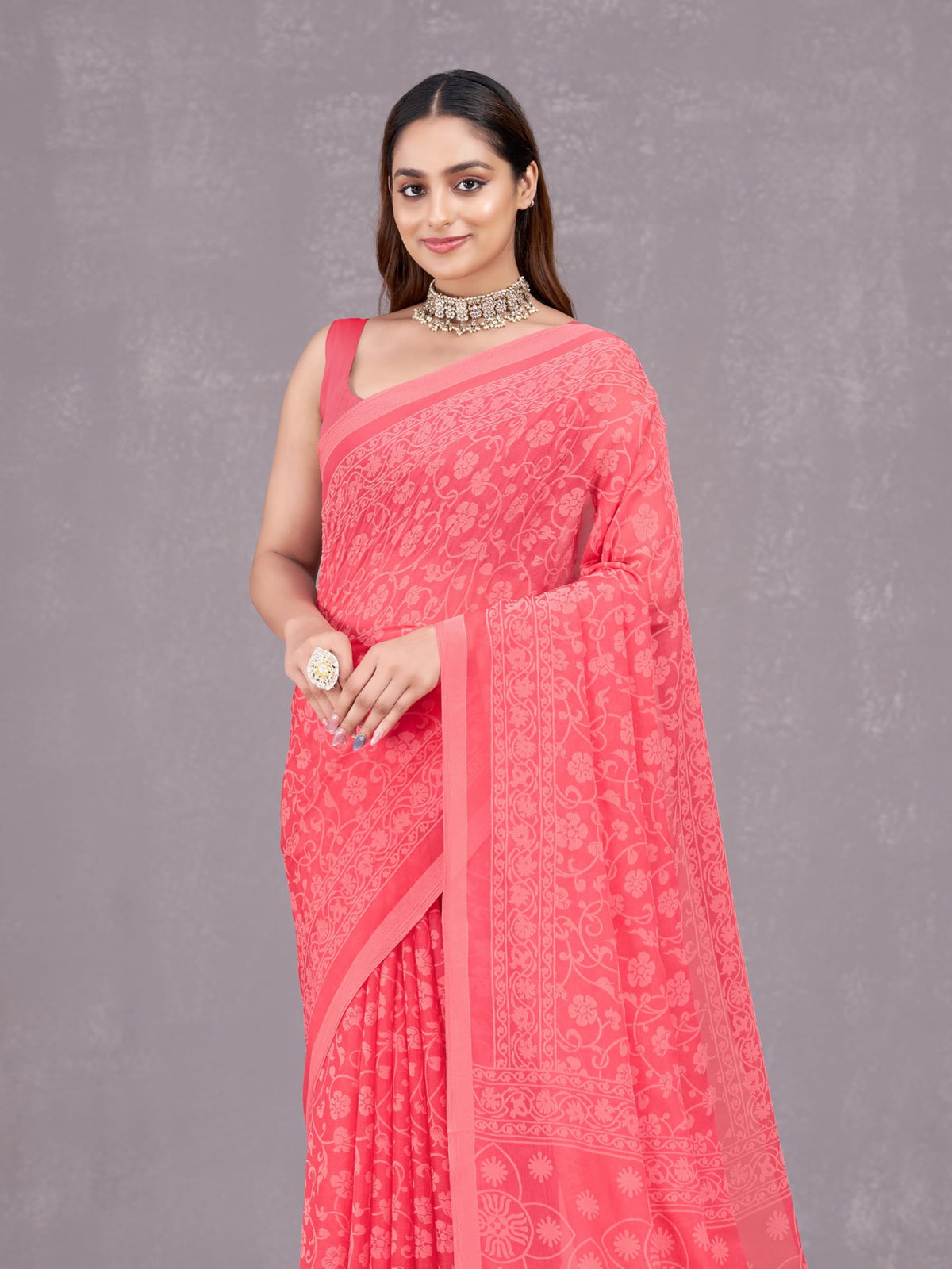 Vasthrlay Chiffon Orange Saree with decorative floral design