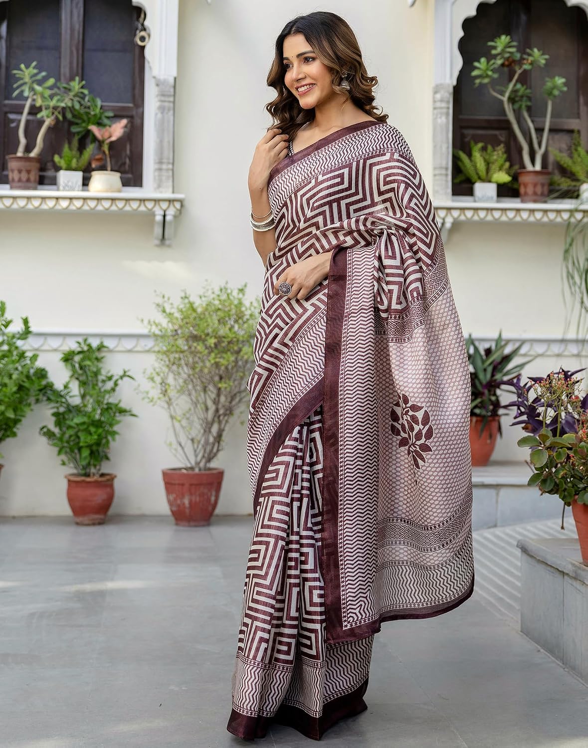Vasthrlay Maroon saree with Printed styling and ethnic look
