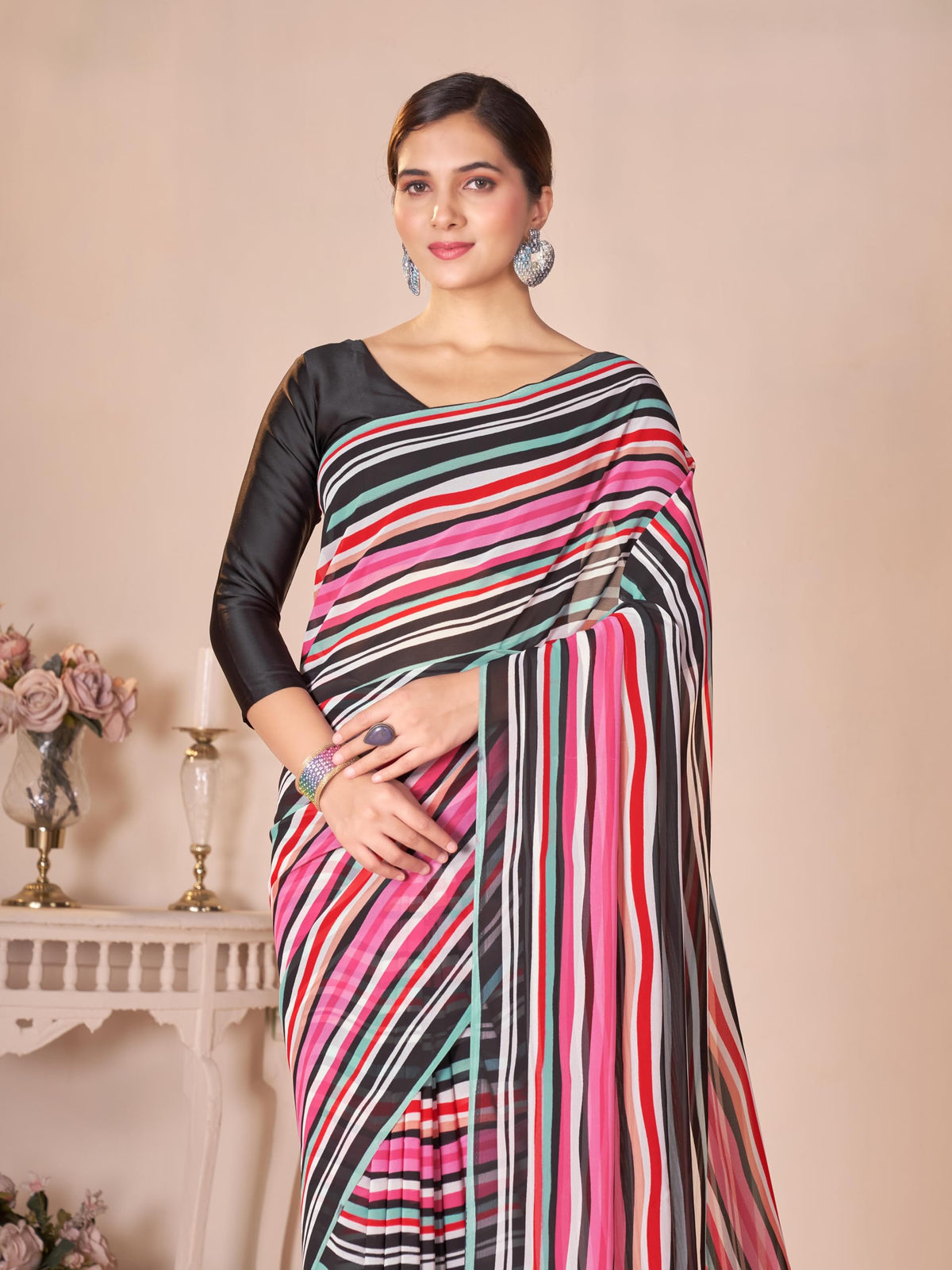 Vasthrlay Georgette Orange Saree with decorative traditional design