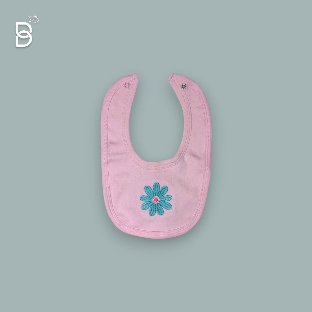 Various pieces of the newborn set arranged artistically