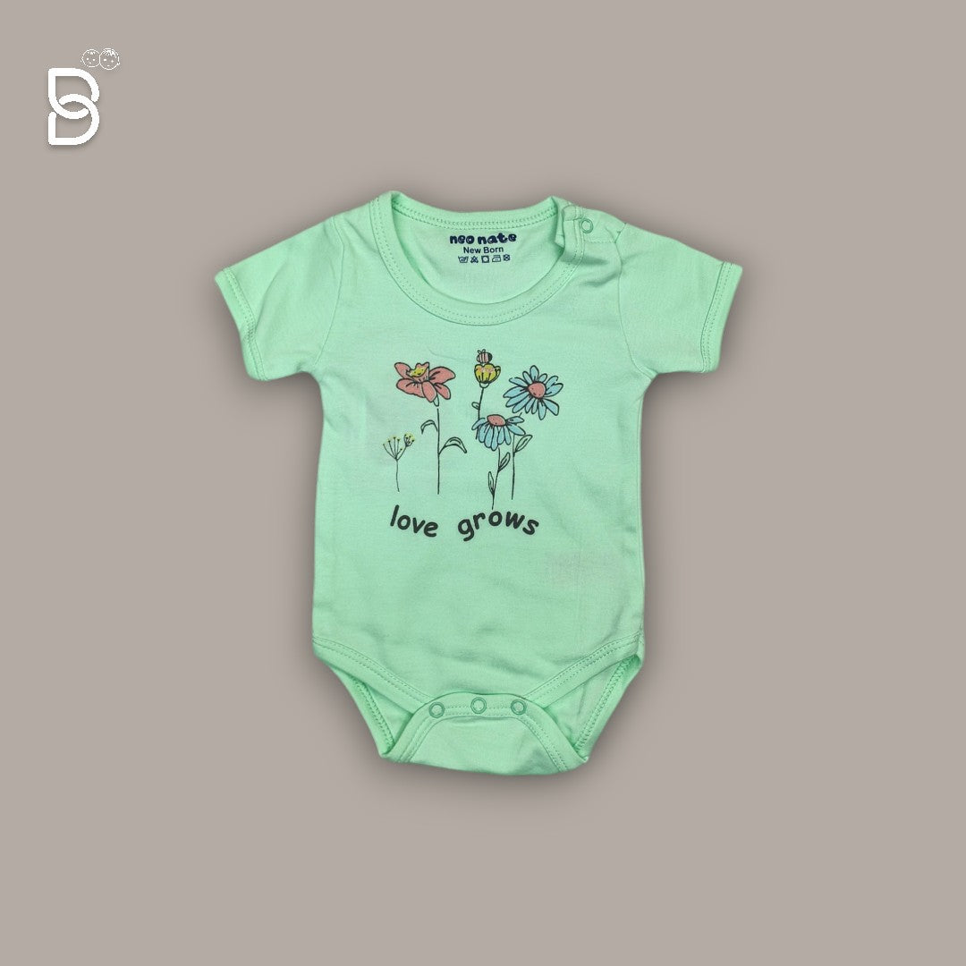 Baby wearing a onesie from the gift set