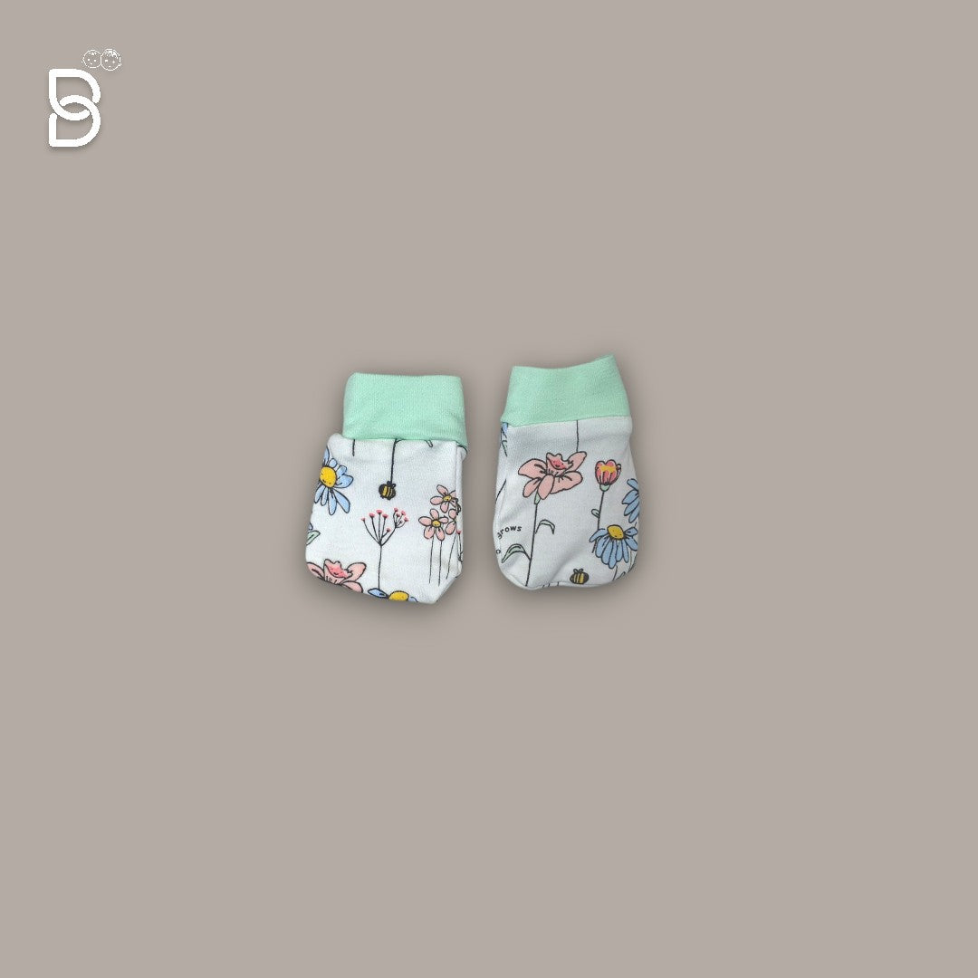Baby's hands reaching for a soft cotton item