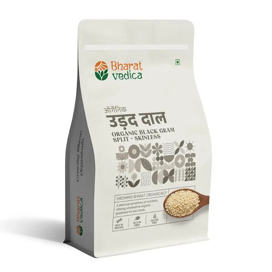 A close-up of Bharat Vedica Organic Black Gram Split Skinless Urad Dal in a bowl, showcasing its pristine quality.