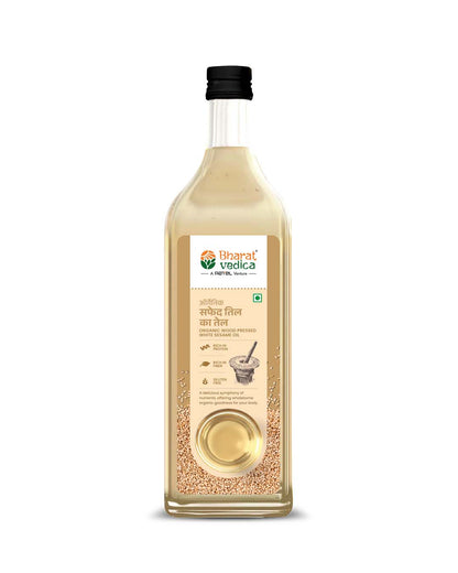 Bharat Vedica Organic Wood Pressed White Sesame Oil bottle with sesame seeds, showcasing its natural origin.