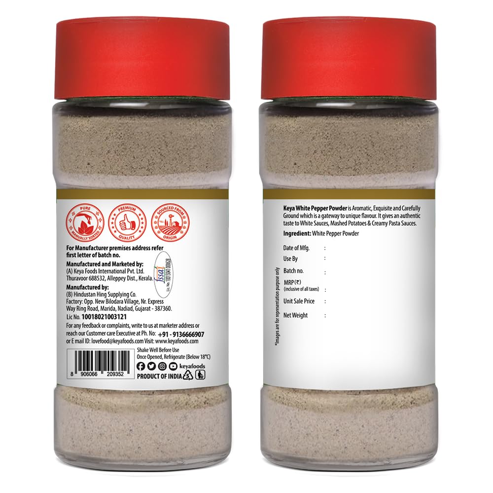 Keya White Pepper Powder in a clear jar with a wooden spoon, showcasing its fine texture. - Image 3